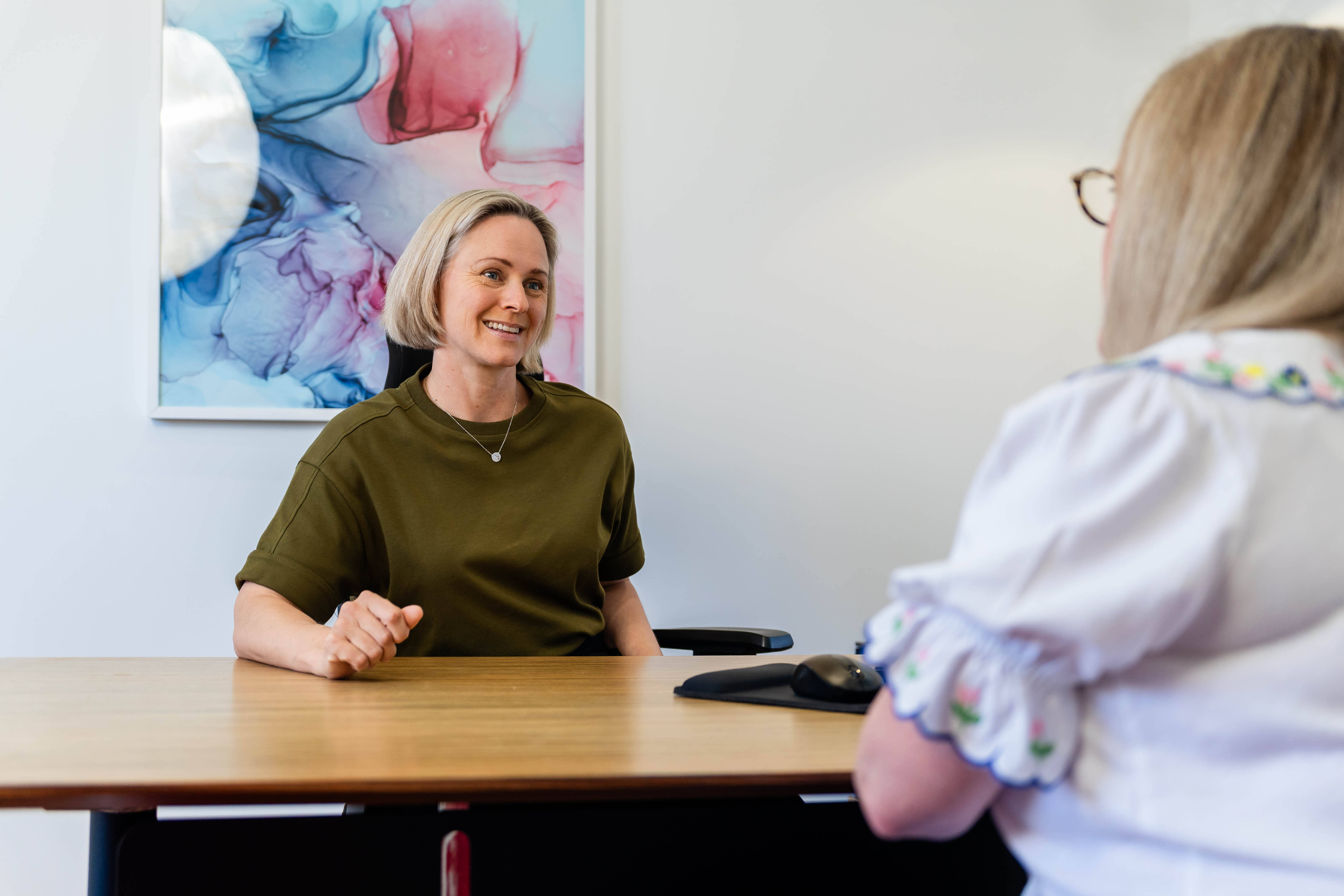 Dr Kimberley Elliott smiling during a consultation